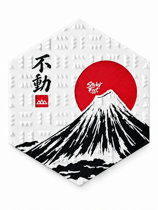 Neutral-white Sticky Feet Fuji snowboard stomp pad with black Mount Fuji artwork and red sun on white